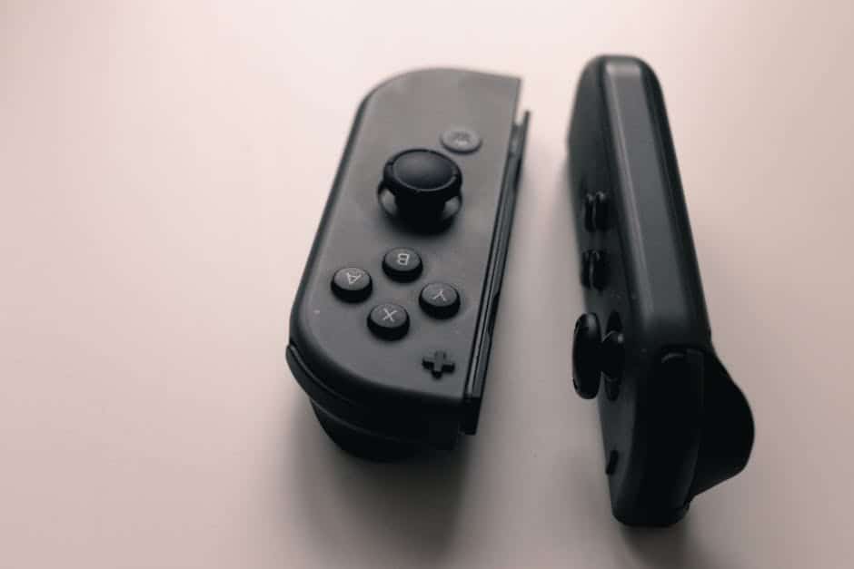 A close-up image of two Nintendo Switch Joy-Con controllers on a neutral background.