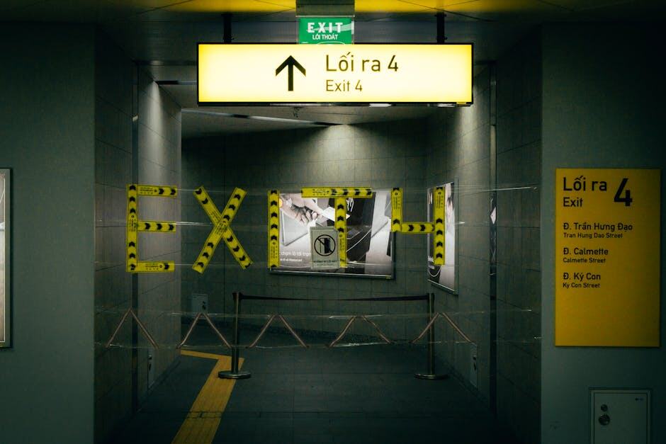 A view of Exit 4 in a Vietnamese metro station with clear signage and yellow line markings.