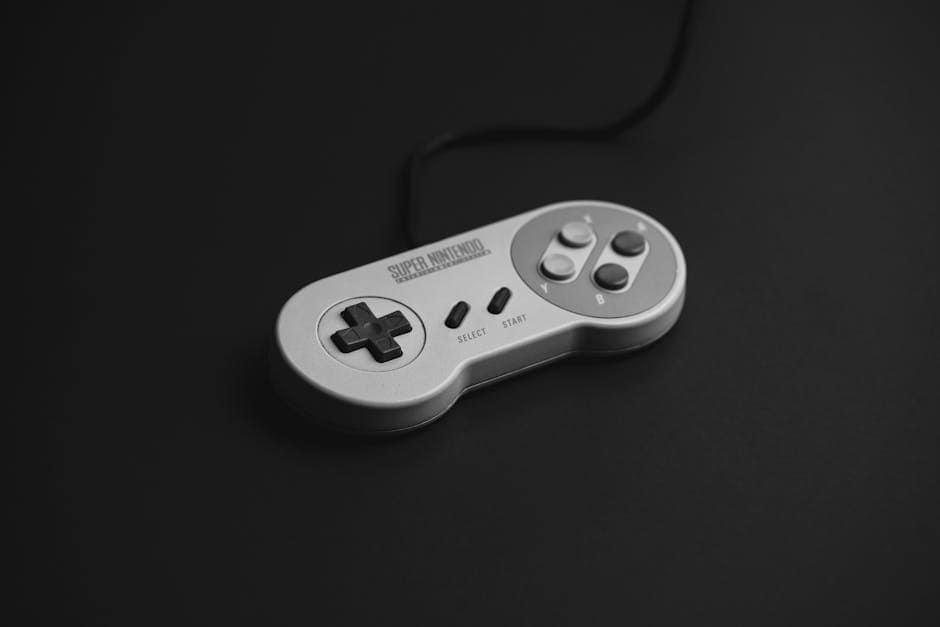 Close-up of a vintage Super Nintendo controller on a black background.