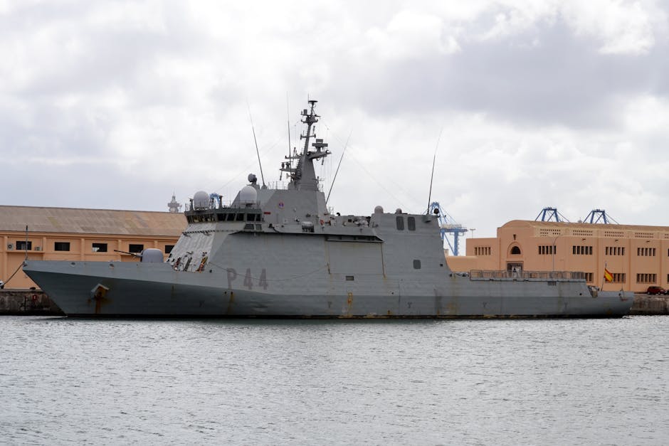 Spanish naval ship P44 docked at Las Palmas de Gran Canaria port under cloudy skies.