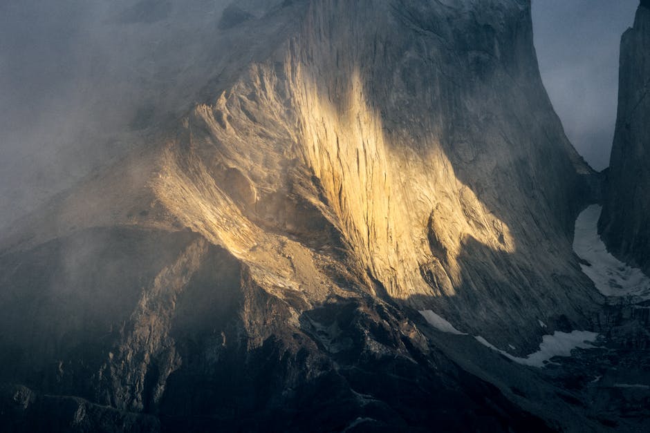 Beautiful sunrise illuminating the rugged cliffs of Torres del Paine in Chilean Patagonia.